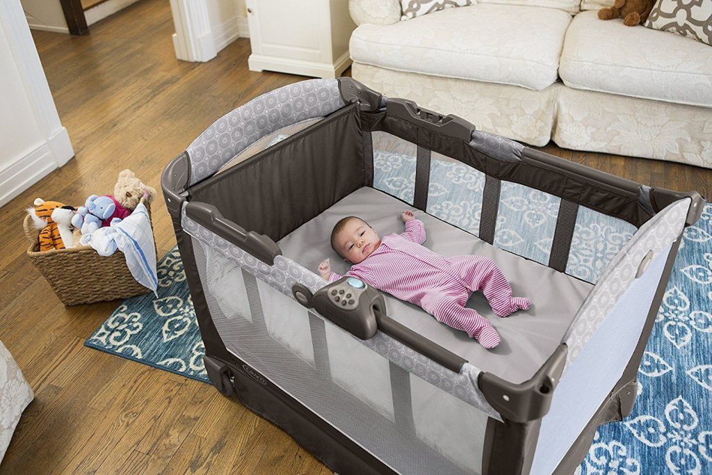 infant sleeping in pack n play bassinet